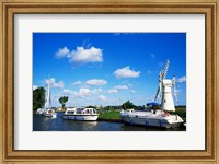 Boats moored near a traditional windmill, River Thurne, Norfolk Broads, Norfolk, England Fine Art Print