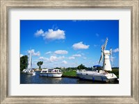 Boats moored near a traditional windmill, River Thurne, Norfolk Broads, Norfolk, England Fine Art Print