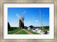 Boat moored near a traditional windmill, River Ant, Norfolk Broads, Norfolk, England Fine Art Print