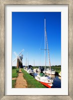 Boats moored near a traditional windmill, Horsey Windpump, Horsey, Norfolk Broads, Norfolk, England Fine Art Print