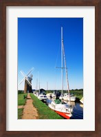 Boats moored near a traditional windmill, Horsey Windpump, Horsey, Norfolk Broads, Norfolk, England Fine Art Print