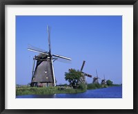 Windmills along a river, Kinderdike, Amsterdam, Netherlands Fine Art Print