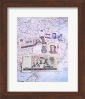 Close-up of yuan notes on a map Fine Art Print