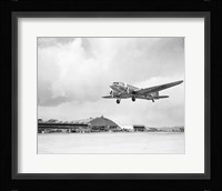 Low angle view of a military airplane landing, Douglas DC-3 Fine Art Print