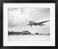 Low angle view of a military airplane landing, Douglas DC-3 Fine Art Print