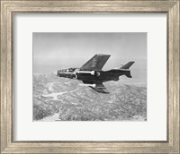 Side profile of a fighter plane carrying sidewinder missiles during flight, F9F-8 Cougar, US Navy Fine Art Print