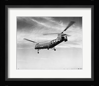 Low angle view of a military helicopter in flight, H-21D Helicopter, US Military Fine Art Print