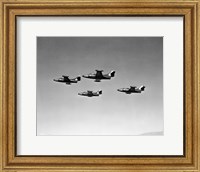 Low angle view of four fighter planes flying in formation, F9F Panther Fine Art Print