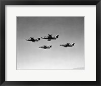 Low angle view of four fighter planes flying in formation, F9F Panther Fine Art Print