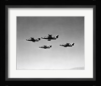Low angle view of four fighter planes flying in formation, F9F Panther Fine Art Print