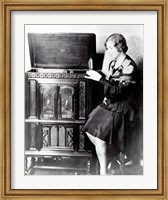 Young woman sitting beside an RCA Radio-Phonograph and Home Recorder Fine Art Print