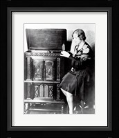 Young woman sitting beside an RCA Radio-Phonograph and Home Recorder Fine Art Print
