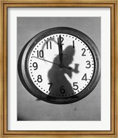 Close-up of the shadow of a person carrying a scythe on a clock Fine Art Print