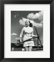 Young woman standing on boat, holding anchor Fine Art Print