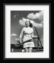 Young woman standing on boat, holding anchor Fine Art Print