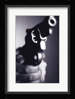 Close-up of a person holding a handgun Fine Art Print