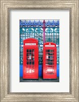 Two telephone booths near a grille, London, England Fine Art Print