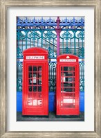 Two telephone booths near a grille, London, England Fine Art Print