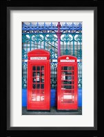 Two telephone booths near a grille, London, England Fine Art Print