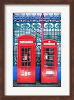 Two telephone booths near a grille, London, England Fine Art Print
