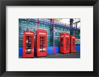 Four telephone booths near a grille, London, England Fine Art Print