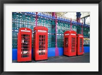 Four telephone booths near a grille, London, England Fine Art Print