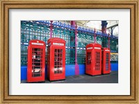 Four telephone booths near a grille, London, England Fine Art Print