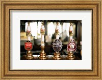 Close-up of beer tap handles in a bar, London, England Fine Art Print