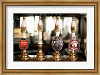 Close-up of beer tap handles in a bar, London, England Fine Art Print
