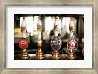 Close-up of beer tap handles in a bar, London, England Fine Art Print