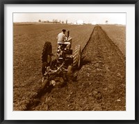 USA, Pennsylvania, Farmer on Tractor Plowing Field Fine Art Print