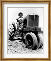 Farmer Sitting on a Tractor in a Field Fine Art Print