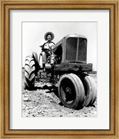 Farmer Sitting on a Tractor in a Field Fine Art Print