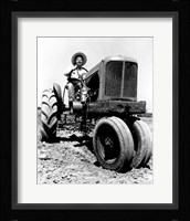 Farmer Sitting on a Tractor in a Field Fine Art Print