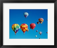 Low angle view of a group of hot air balloons in the sky Fine Art Print