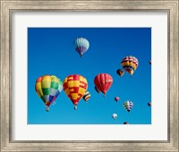 Low angle view of a group of hot air balloons in the sky Fine Art Print