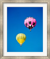 A Pink and a Yellow Hot Air Balloon Fine Art Print
