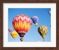 Low angle view of hot air balloons in the sky Fine Art Print