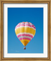 Low angle view of a hot air balloon in the sky, Albuquerque, New Mexico, Yellow & Pink Fine Art Print