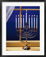 Close-up of burning candles on a menorah at a window Fine Art Print