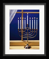 Close-up of burning candles on a menorah at a window Fine Art Print