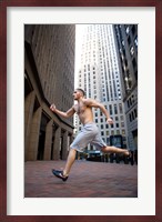 Side profile of a young man running in a city Fine Art Print
