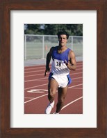 Male athlete running on a running track Fine Art Print
