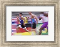 Side profile of three men running on a running track Fine Art Print