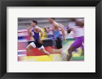 Side profile of three men running on a running track Fine Art Print