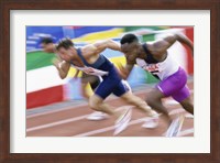 Side profile of three men running low on a running track Fine Art Print