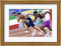 Side profile of three men running low on a running track Fine Art Print