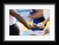 Mid section view of runners exchanging baton at a relay race Fine Art Print
