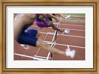 Side profile of three people jumping a hurdle Fine Art Print