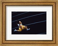 High angle view of a young man running on a running track Fine Art Print